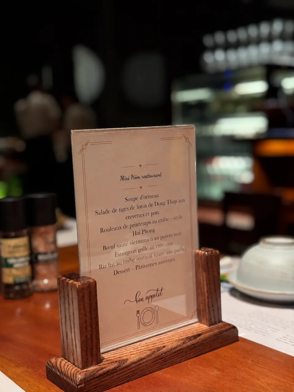 A tailored menu and table setting at MiRi Hôm